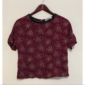 Burgundy patterned shirt.